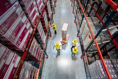 warehouse workers at work between rows of tall she 2024 10 31 01 12 28 utc 1